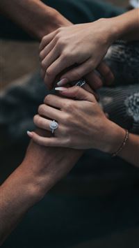 man and woman holding each others hands wallpaper