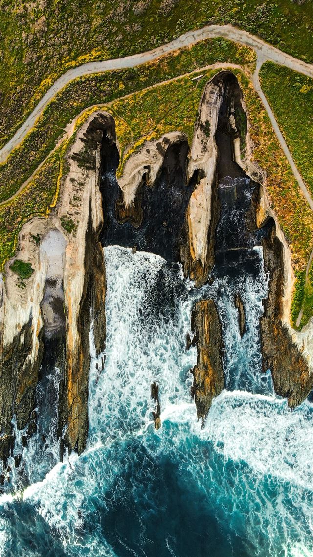 1080x1920 waves breaking on brown rock cliff in beach - water iPhone 8 Wallpaper