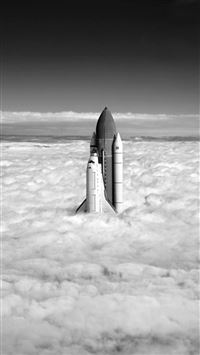 Grayscale Rocket Up Towards Cloudy SKy wallpaper