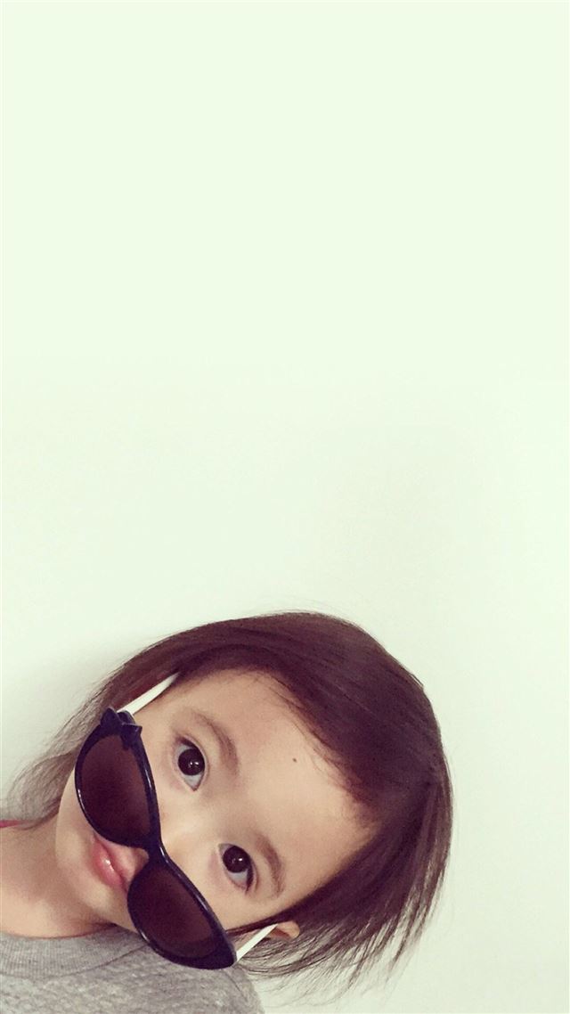 1080x1920 Cute Lovely Sweeet Girl Wearing Glass Simple Wall - background iPhone 8 Wallpaper