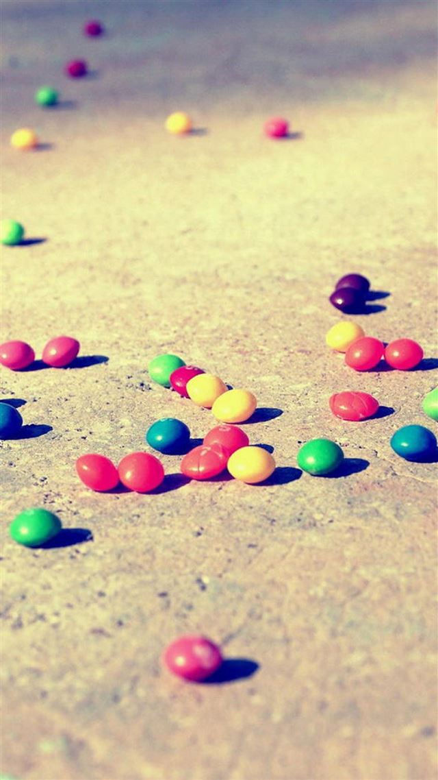 1080x1920 Colorful Candies On The Ground  - yellow iPhone 8 Wallpaper