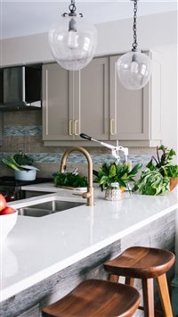 Nicely designed white kitchen with lots of greener... wallpaper