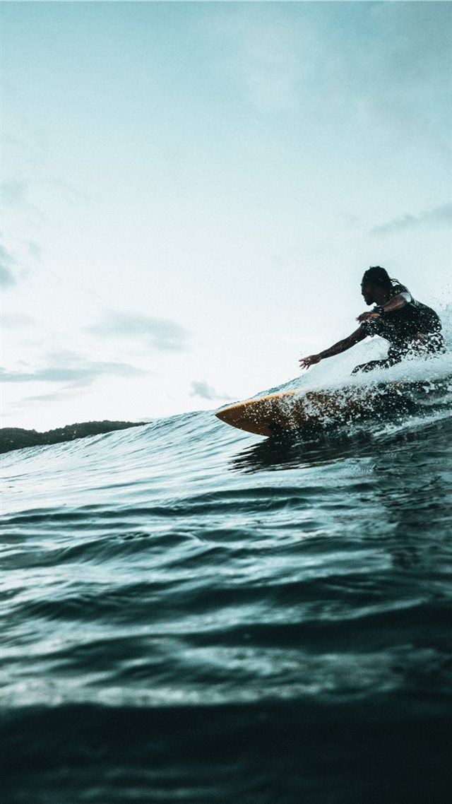 1080x1920 man surfboarding during daytime - nature iPhone 8 Wallpaper