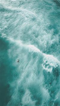 birds eye view photo of a person on body of water wallpaper