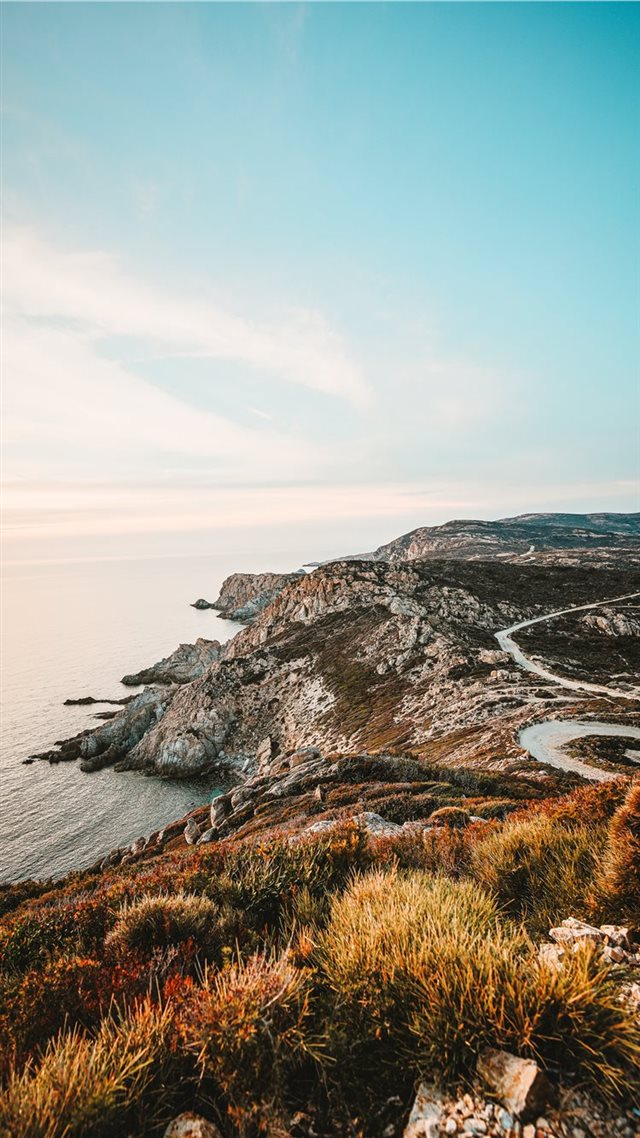 1080x1920 rocky cliff facing ocean under blue sky - scenery iPhone 8 Wallpaper