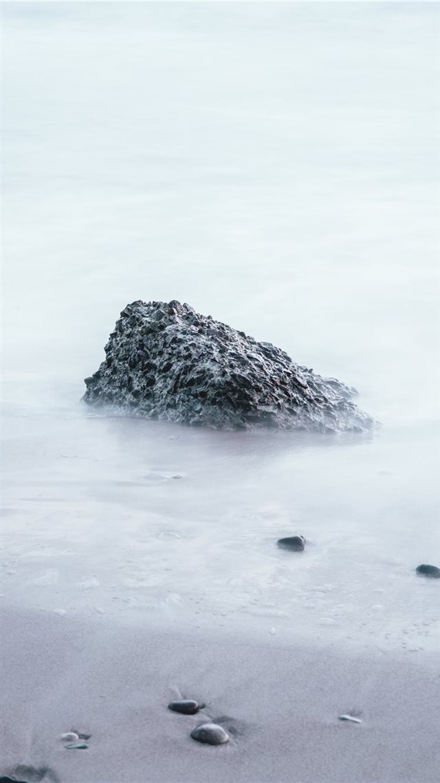 1080x1920 rock on sand shore during day - mountain iPhone 8 Wallpaper