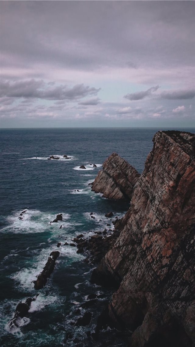 1080x1920 rock formation near the sea during daytime - spain iPhone 8 Wallpaper