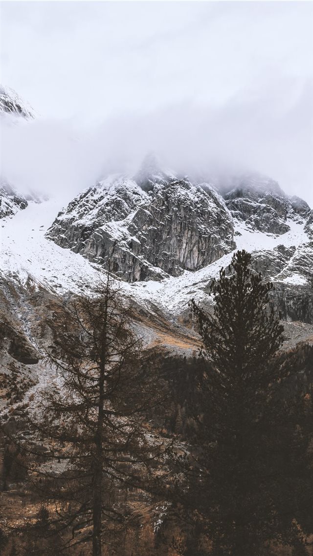 1080x1920 snow capped rocky mountain under cloudy sky - tree iPhone 8 Wallpaper