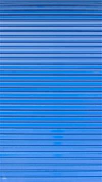 Blue roller shutter of a warehouse wallpaper
