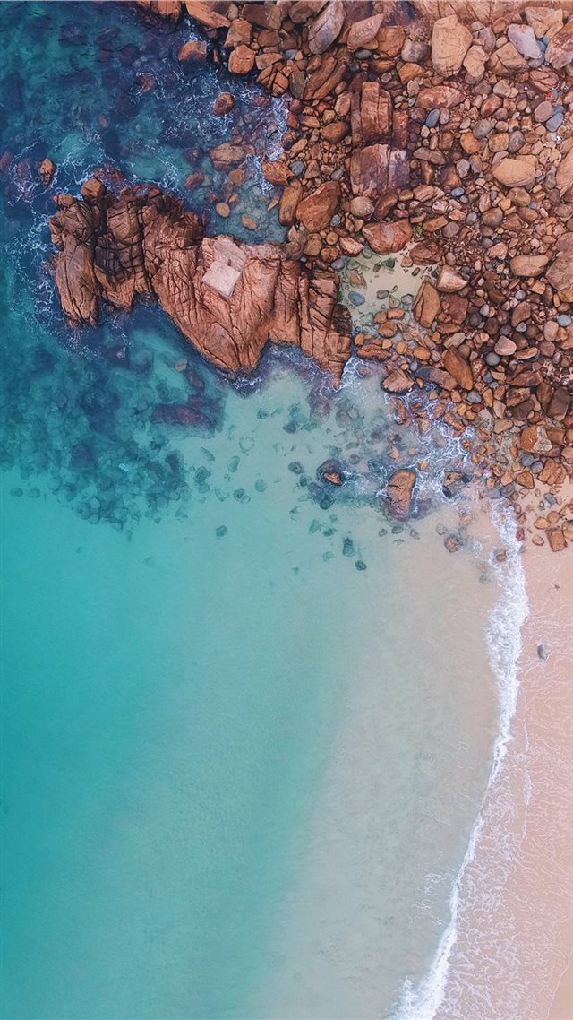 1080x1920 aerial view of rocks near body of water - shek o beach iPhone 8 Wallpaper