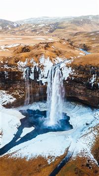 aerial photography of waterfalls near mountains at... wallpaper