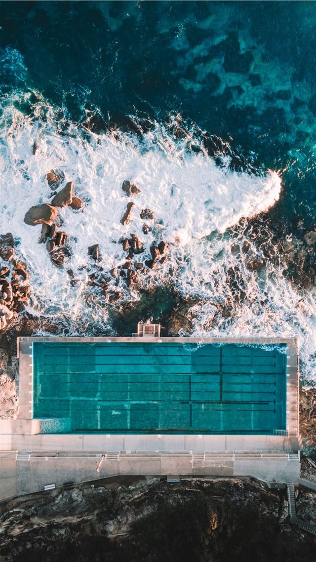 1080x1920 aerial photo of concrete building near sea - australia iPhone 8 Wallpaper