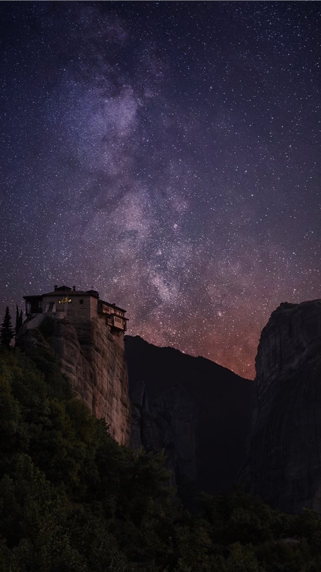 1080x1920 milky way above rocks - space iPhone 8 Wallpaper