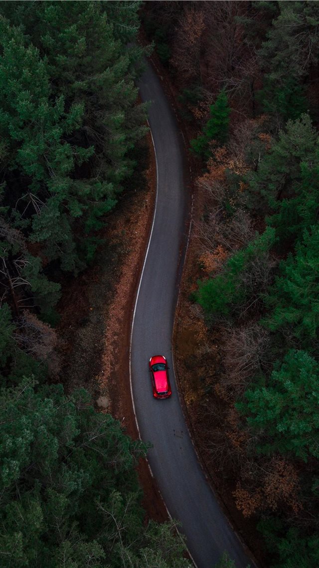 1080x1920 aerial photo of red car passing by green trees - car iPhone 8 Wallpaper