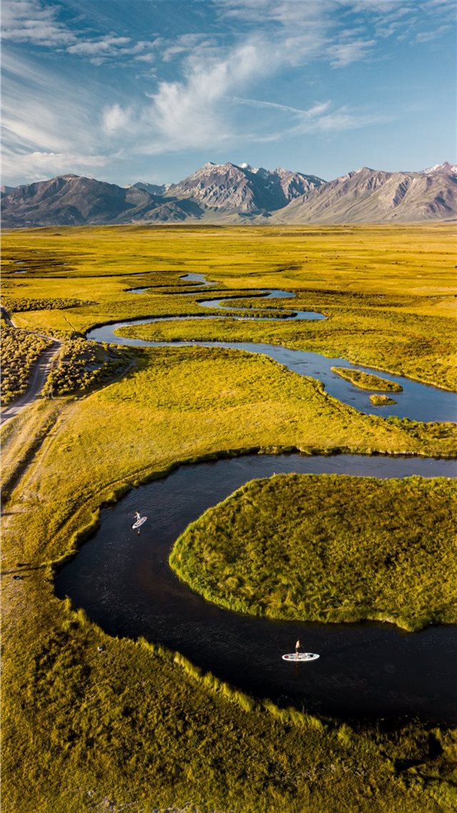 1080x1920 aerial photo of grass field under cloudy sky - water iPhone 8 Wallpaper