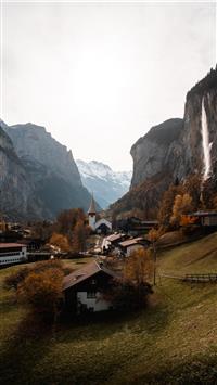 brown and white house near mountain during daytime wallpaper