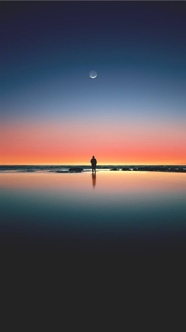 1080x1920 silhouette of man standing on seashore - moon iPhone 8 Wallpaper