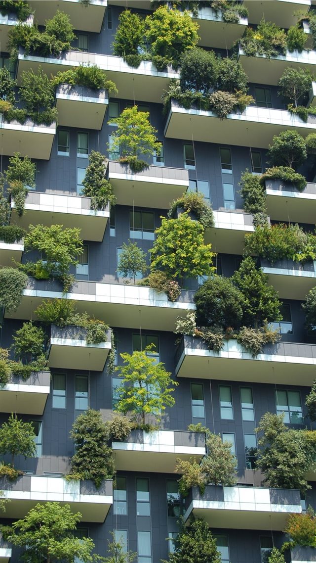 1080x1920 low angle photo of gray building with green plants - trees iPhone 8 Wallpaper