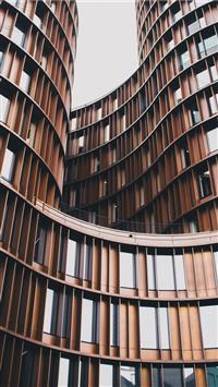 close up photography of brown concrete building wallpaper