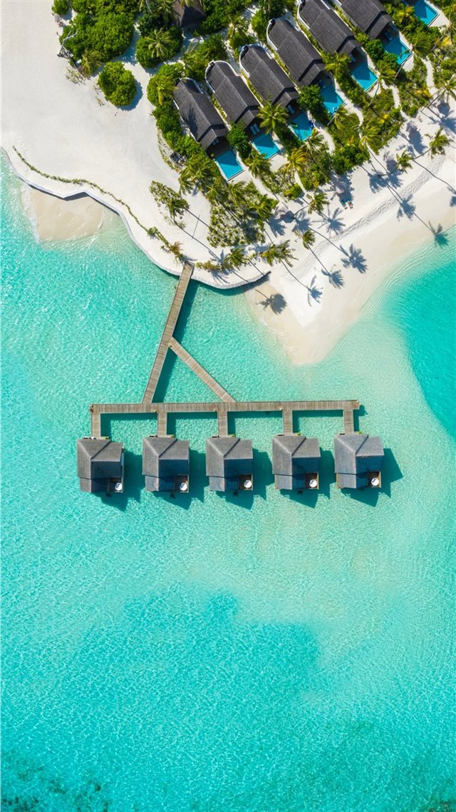 1080x1920 brown huts on body of water in aerial photography - ocean iPhone 8 Wallpaper