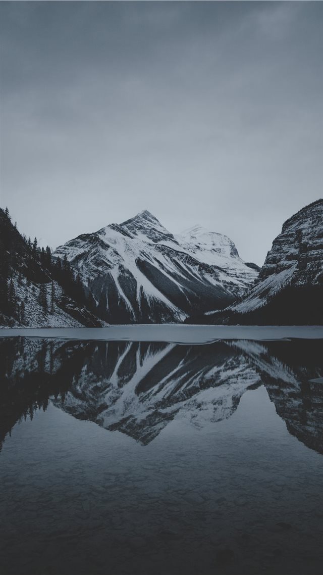 1080x1920 snow mountains and lake undr gray sky - mountain iPhone 8 Wallpaper