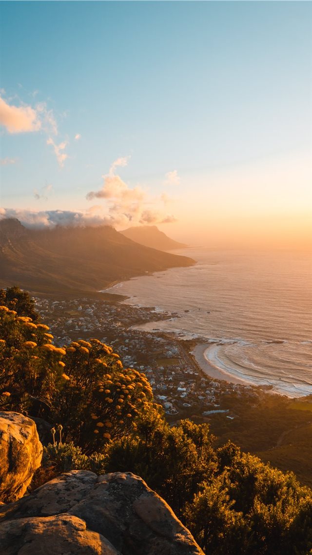 1080x1920 green trees on mountain near sea during daytime - water iPhone 8 Wallpaper