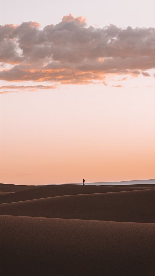 1080x1920 silhouette of person standing on desert -  iPhone 8 Wallpaper