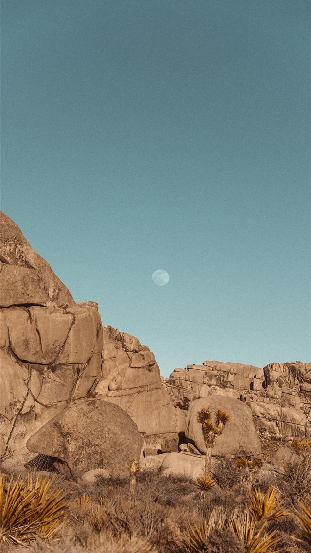 1080x1920 brown rock formation under blue sky during daytime - moon iPhone 8 Wallpaper