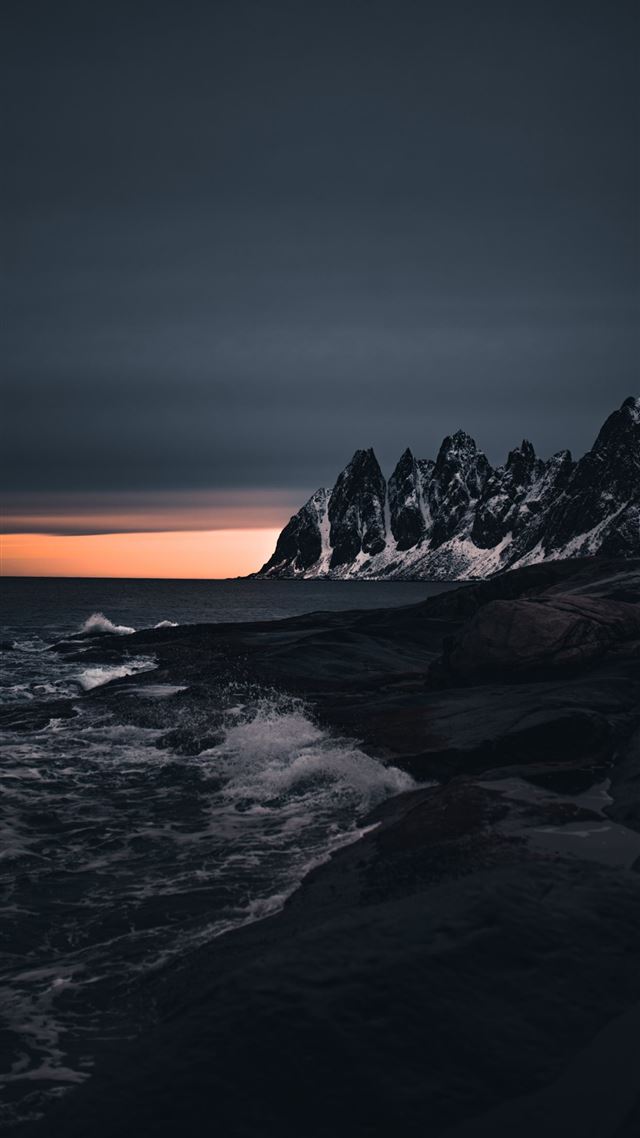 1080x1920 rocky mountain near body of water during sunset - ocean iPhone 8 Wallpaper