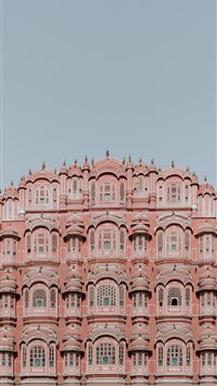 pink and white concrete structure under clear sky wallpaper