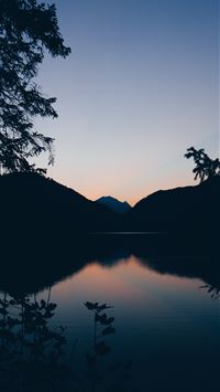 silhouette of mountain lake and trees in nature ph... wallpaper