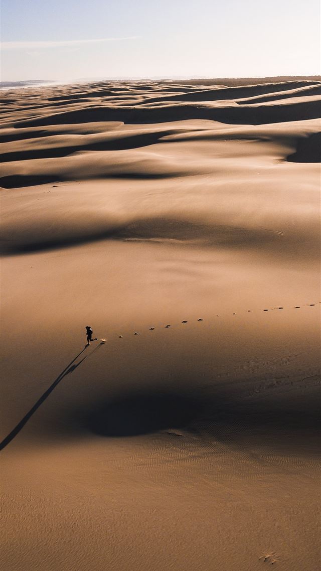 1080x1920 person walking on the desert photography - sun iPhone 8 Wallpaper
