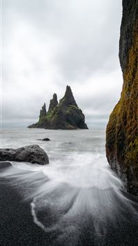 time lapse of shore near rock formation at daytime wallpaper