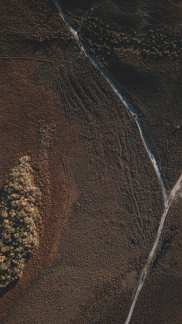 1080x1920 aerial photography of brown field during daytime - unnamed road iPhone 8 Wallpaper