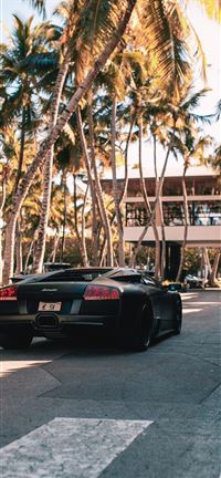 black sports coupe on road during daytime wallpaper