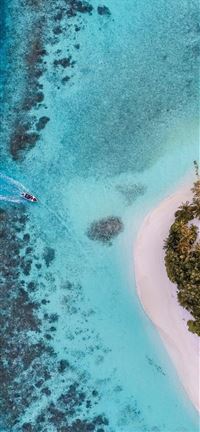 aerial photo of boat moving towards the white isla... wallpaper