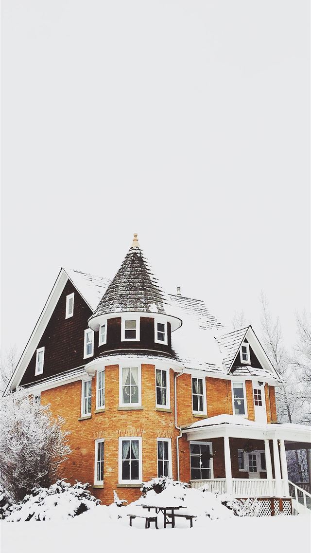 640x1136 orange and gray concrete house surround by snow - winter iPhone Wallpaper