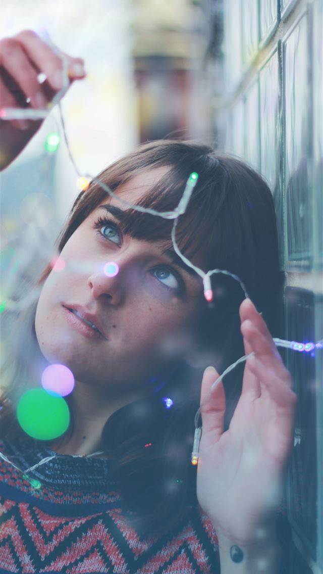 640x1136 woman holding string lights - canada iPhone Wallpaper