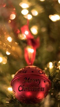 red Christmas bell on Christmas tree wallpaper