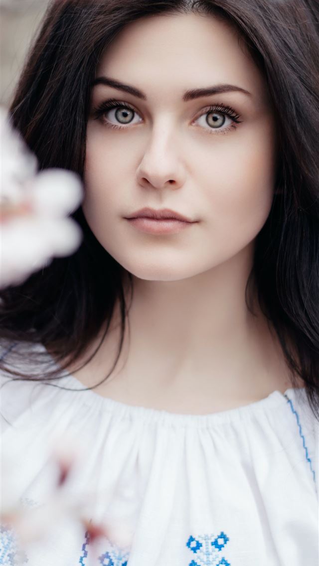 640x1136 woman standing near white petaled flower - moldova iPhone Wallpaper