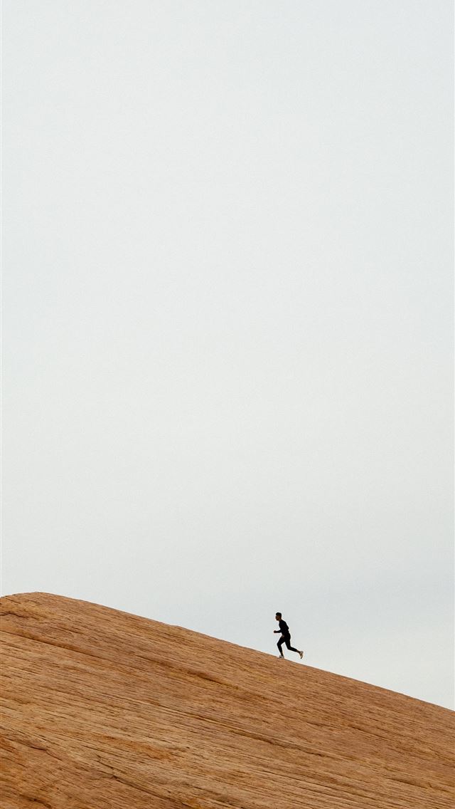 640x1136 person running on top on hill during daytime - simple iPhone Wallpaper