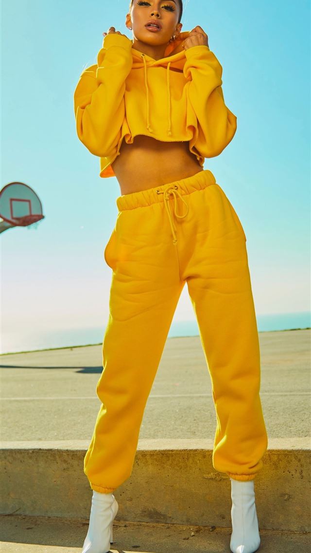 640x1136 woman in yellow tracksuit standing on basketball c... -  iPhone Wallpaper