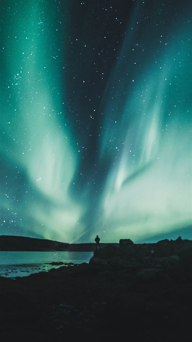 640x1136 person standing near body of water during aurora n... - iceland iPhone Wallpaper
