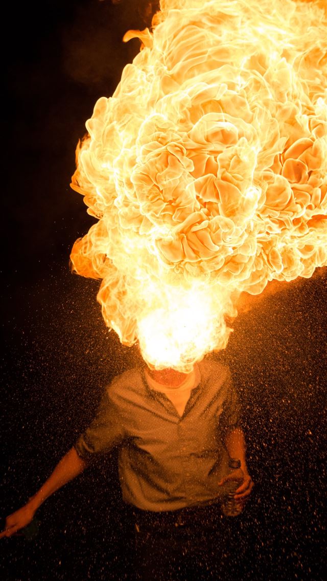 640x1136 man spitting fire - yellow iPhone Wallpaper