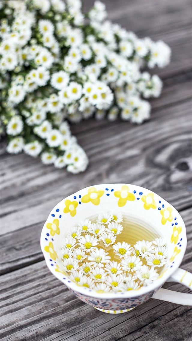 640x1136 white and yellow cup with flowers on table - floral iPhone Wallpaper