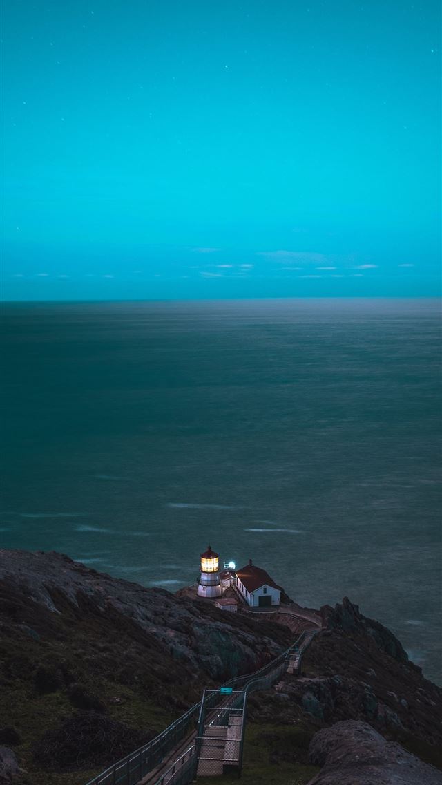 640x1136 brown and white house on cliff in front of sea - cyan iPhone Wallpaper
