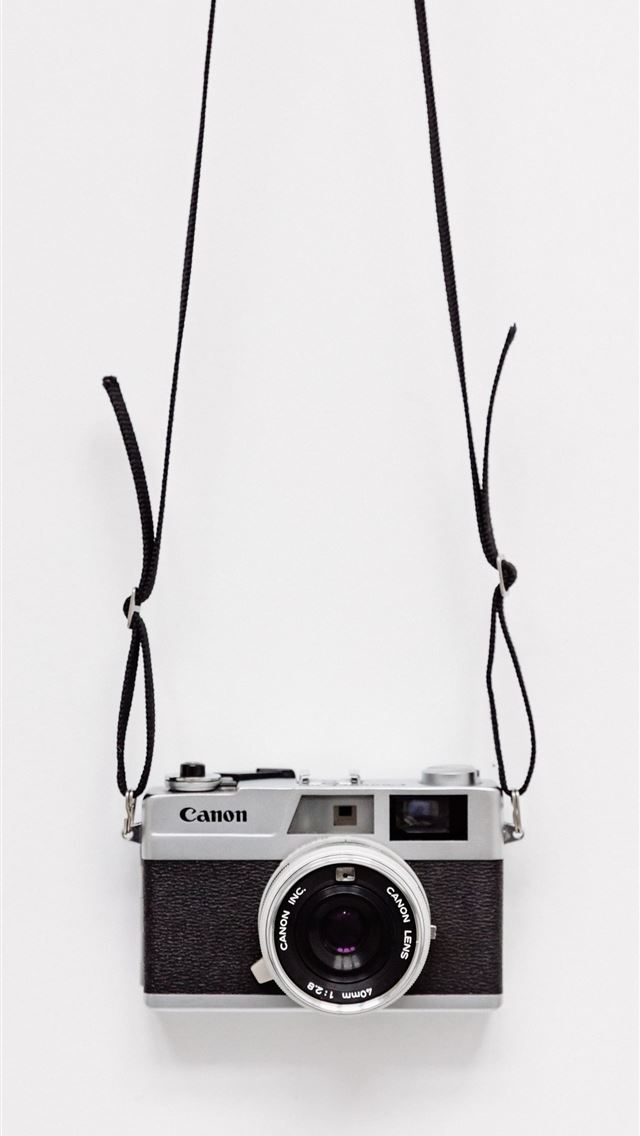 640x1136 black and gray Canon camera on white surface -  iPhone Wallpaper