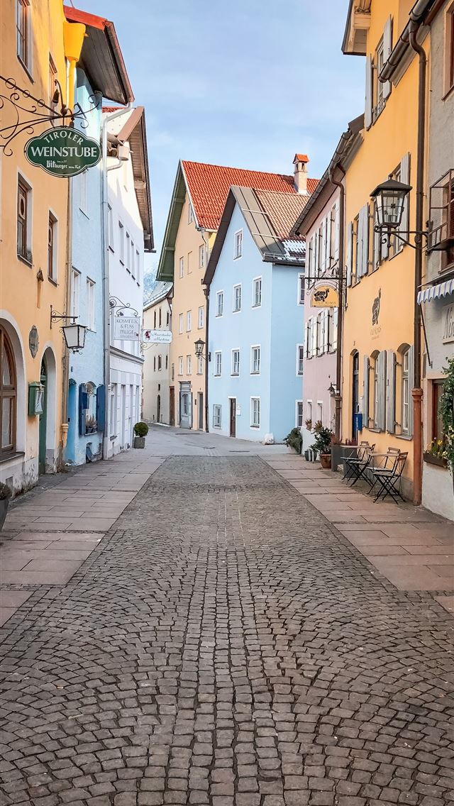 640x1136 empty street between concrete buildings during day... - road iPhone Wallpaper
