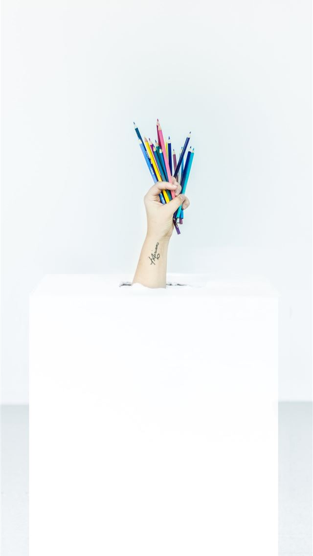 640x1136 person's hand burst out of box holding assorted co... - united states iPhone Wallpaper