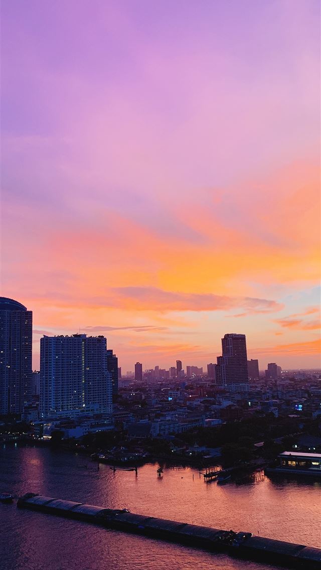 640x1136 city skyline across body of water during sunset -  iPhone Wallpaper